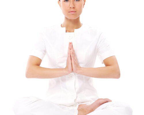 Beautiful girl doing yoga exercises isolated on white